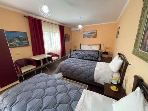 Standard Quadruple Room, 1 Bedroom, Non Smoking, Air conditioning | Desk, blackout drapes, free WiFi, bed sheets