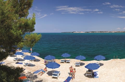 Beach nearby, sun loungers, beach umbrellas, beach volleyball