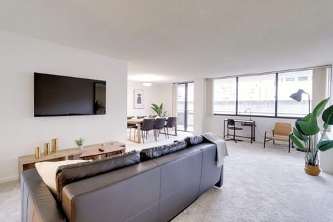 Apartment, City View | Living area | 50-inch Smart TV with cable channels