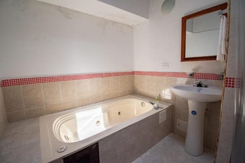 Deluxe Double Room | Bathroom | Combined shower/tub, towels, soap, toilet paper