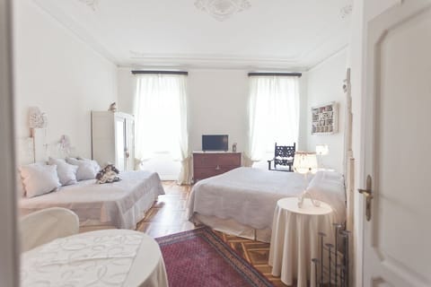 Deluxe Quadruple Room, City View | In-room safe, laptop workspace, free WiFi