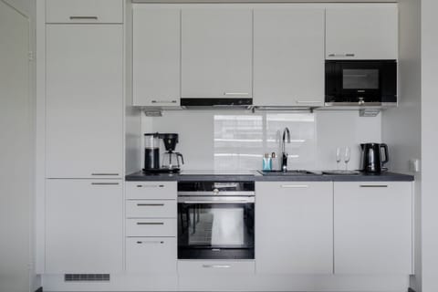 Apartment, Balcony, City View | Private kitchen | Coffee/tea maker, electric kettle, toaster, highchair