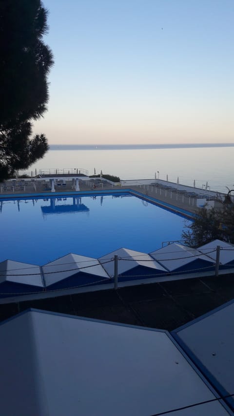 2 outdoor pools, open 9 AM to 7 PM, pool umbrellas, sun loungers