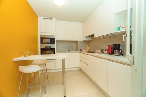 Deluxe Apartment, Balcony, City View | Desk, laptop workspace, soundproofing, iron/ironing board