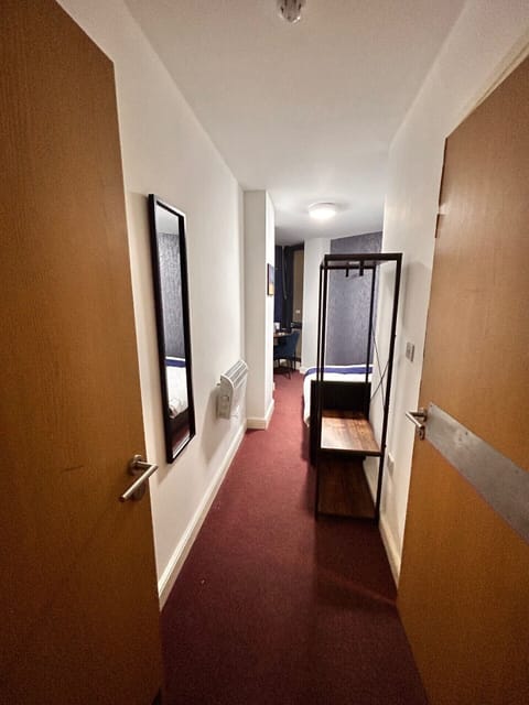 Economy Double Room | Desk, laptop workspace, blackout drapes, iron/ironing board