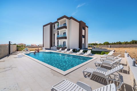 Studio, Multiple Bedrooms, Balcony, Garden View | Pool | Outdoor pool