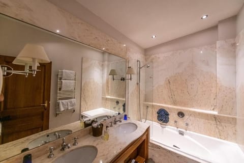 Separate tub and shower, hair dryer, bathrobes, slippers