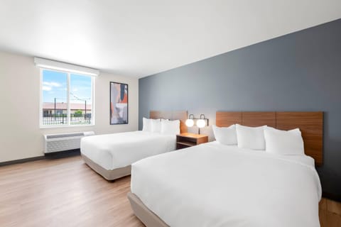 Desk, laptop workspace, blackout drapes, iron/ironing board