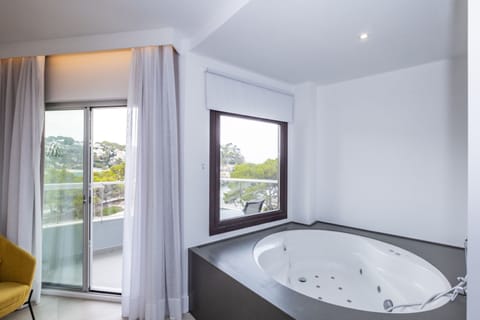 Premium Double Room, Hot Tub, Sea View | Minibar, in-room safe, desk, laptop workspace