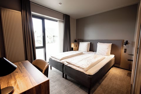 Premium bedding, down comforters, in-room safe, desk