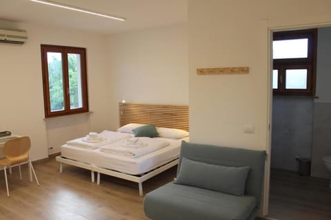 Classic Triple Room, Courtyard View | Desk, free WiFi