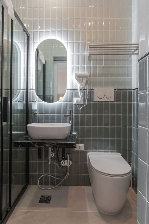 Shower, free toiletries, hair dryer, slippers