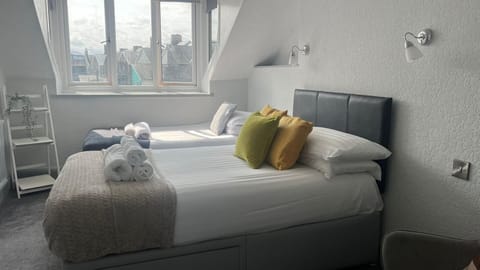 Triple Room, Partial Sea View | Desk, iron/ironing board, free WiFi