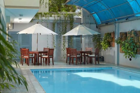 Outdoor pool, open 10:00 AM to 10:00 PM, sun loungers