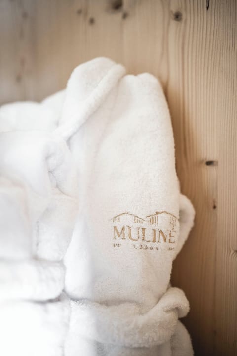 Designer toiletries, hair dryer, bathrobes, slippers