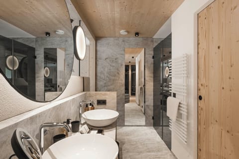 Designer toiletries, hair dryer, bathrobes, slippers