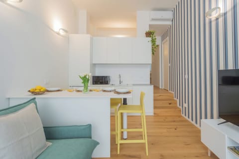 Apartment (1 Bedroom) | Living area | 32-inch Smart TV with cable channels