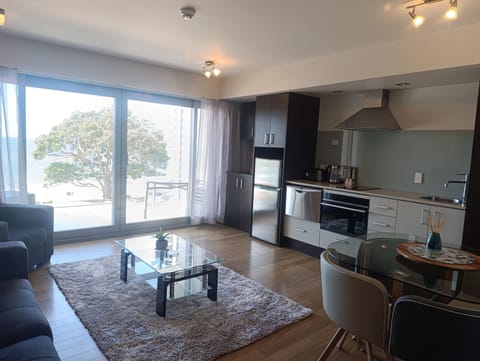 Apartment, 1 Bedroom, Beach View | Living area | Flat-screen TV