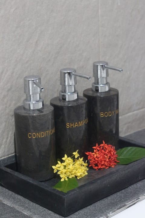 Deluxe Suite, 1 Queen Bed, Balcony, Pool View | Bathroom | Bathrobes, slippers