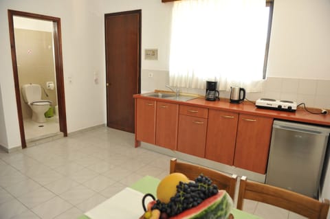 Apartment, 2 Bedrooms | Private kitchen | Fridge, stovetop, coffee/tea maker, electric kettle