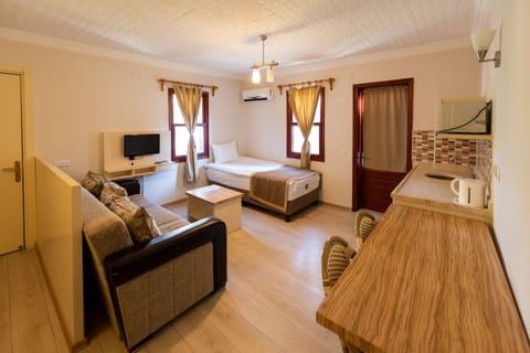 Comfort Suite, 1 Bedroom | Living area | LCD TV