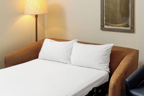 Premium bedding, down comforters, desk, laptop workspace