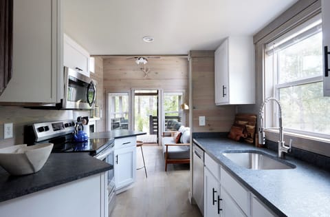 Stovetop, coffee/tea maker, cookware/dishes/utensils, cleaning supplies