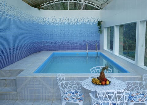 Indoor pool, outdoor pool, pool umbrellas, sun loungers