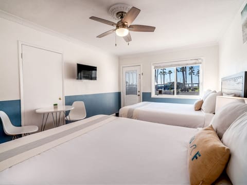 Two Queen Beds with Partial Ocean View | Iron/ironing board, free WiFi, bed sheets