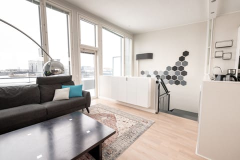 Luxury Penthouse, City View | Living area | 52-inch flat-screen TV with cable channels