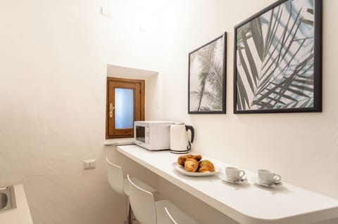 Apartment (1 Bedroom) | Private kitchen | Microwave, espresso maker, electric kettle, highchair