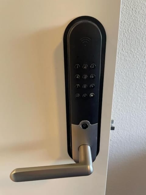 Desk, laptop workspace, blackout drapes, iron/ironing board