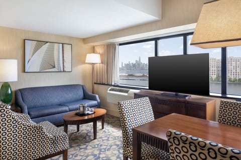 Executive Suite, 1 Bedroom | Living room | 55-inch TV with cable channels