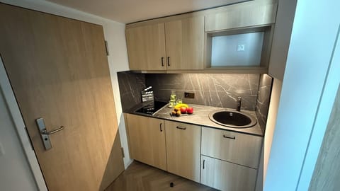 Comfort Studio, Courtyard View | Private kitchen | Coffee/tea maker, highchair