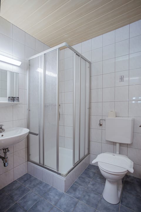 Bathtub, hair dryer, towels, soap