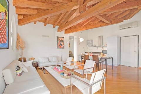 Family Apartment, 2 Bedrooms, 2 Bathrooms, Lakeside (Morgante Salò-Lake view & parking) | Living area | 21-inch flat-screen TV with cable channels, TV