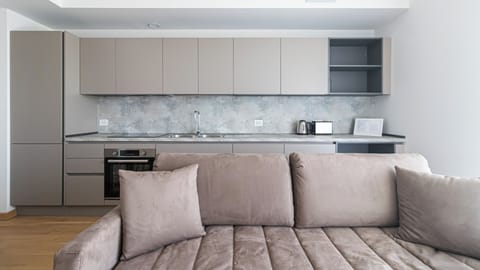 Apartment (1 Bedroom) | Living area | 32-inch TV with cable channels