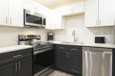 Suite, 1 Bedroom | Private kitchen | Fridge, microwave, oven, stovetop