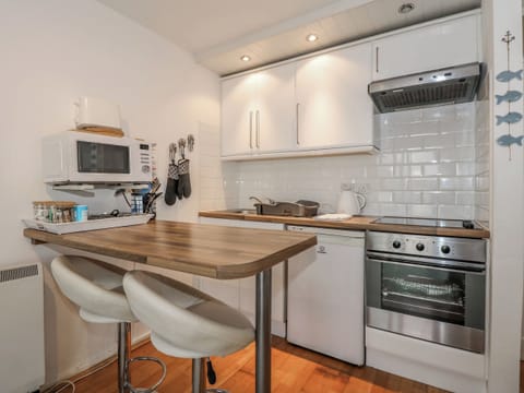 Fridge, electric kettle, cookware/dishes/utensils