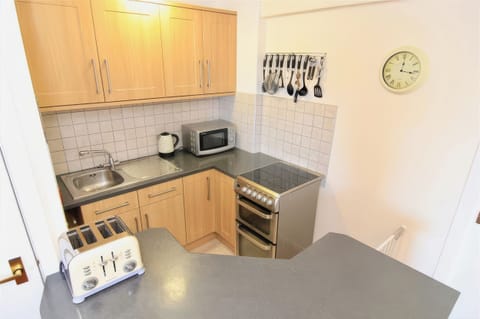 Fridge, electric kettle, toaster, cookware/dishes/utensils