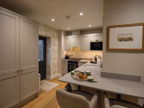 Fridge, dishwasher, electric kettle, cookware/dishes/utensils