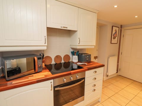 Fridge, electric kettle, cookware/dishes/utensils