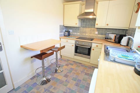 Fridge, dishwasher, electric kettle, cookware/dishes/utensils