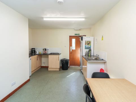 Fridge, electric kettle, cookware/dishes/utensils