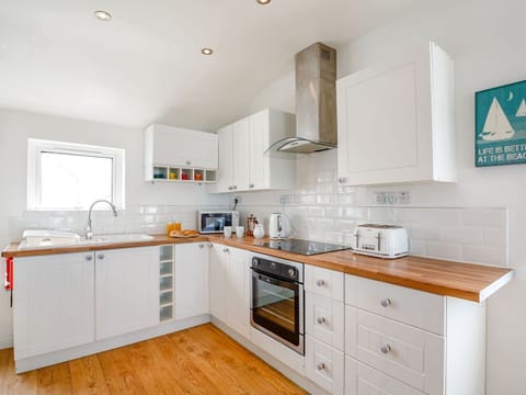 Fridge, electric kettle, toaster, cookware/dishes/utensils