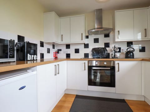 Fridge, electric kettle, toaster, cookware/dishes/utensils