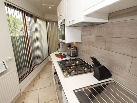 Fridge, dishwasher, electric kettle, cookware/dishes/utensils