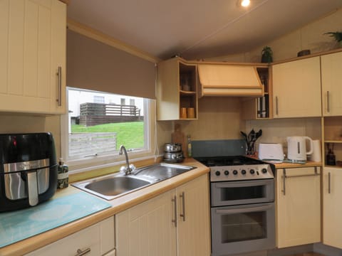 Fridge, electric kettle, toaster, cookware/dishes/utensils