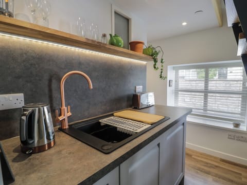 Fridge, electric kettle, toaster, cookware/dishes/utensils