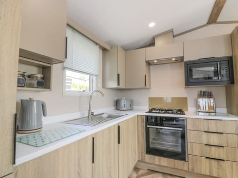 Fridge, electric kettle, toaster, cookware/dishes/utensils